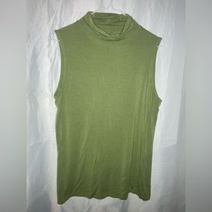 Green turtleneck, sleeveless. Super comfortable fabric.